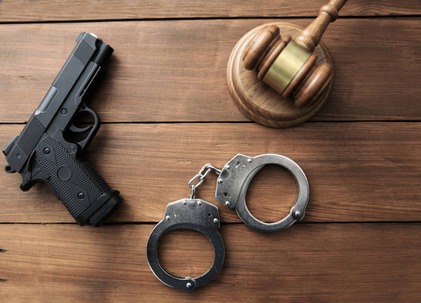 istock Gun with hammer of the judge 1227423078