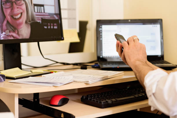 istock Mature man in video conference in temporary home office. 1227423827