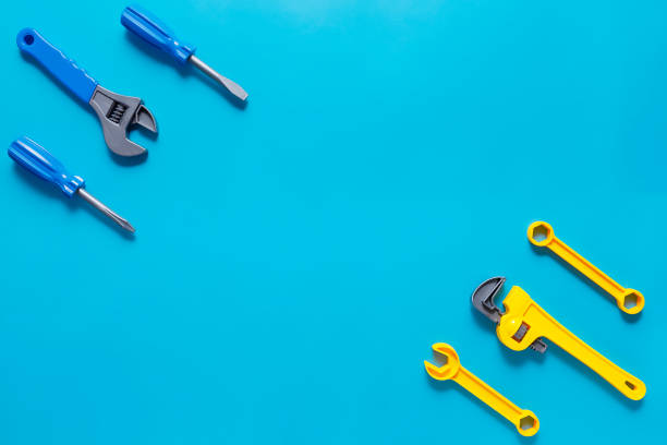 istock Toys background. Top view of toy tools on blue background 1227425324