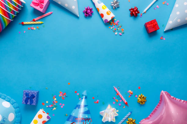 istock flatlay Birthday party card on a blue background with copy space for text 1227425951