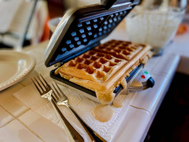 istock Waffle iron cooking at home 1227427392