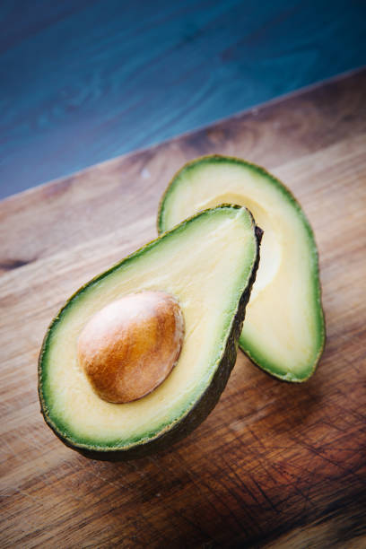 istock slices of avocado on a white background 1227432976