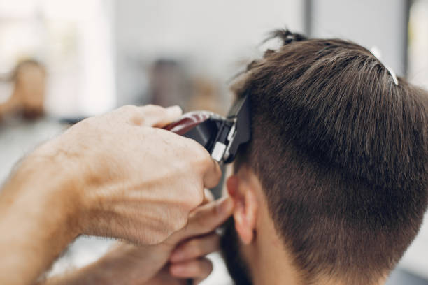 istock Stylish man sitting in a barbershop 1227437869