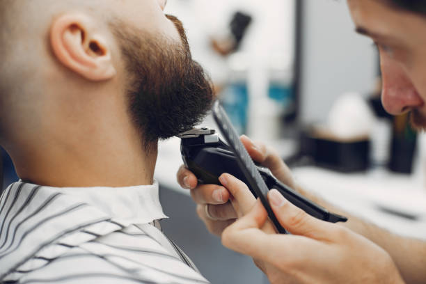 istock Stylish man sitting in a barbershop 1227437903