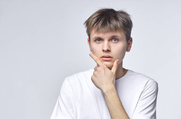istock The young guy shows various emotions. Talented portrays the inner state and mood. Advertisement concept 1227437953
