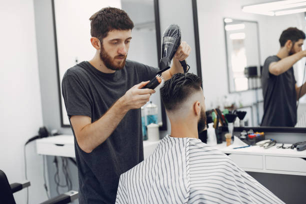 istock Stylish man sitting in a barbershop 1227437976