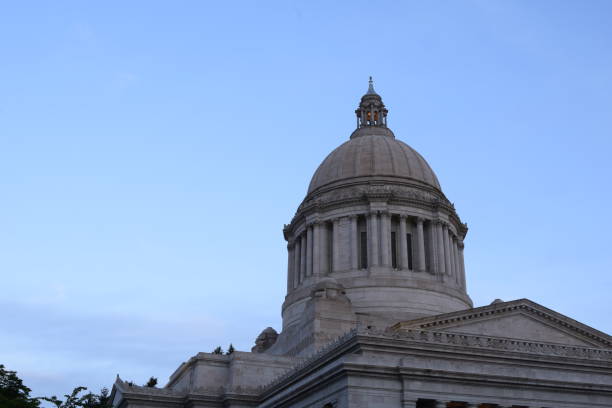 istock Majestic State Capitol Dome Against Soft Blue Morning Sky 1227440229