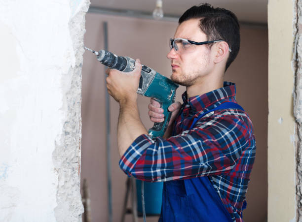 istock Builder handyman with electric drill indoors 1227441423