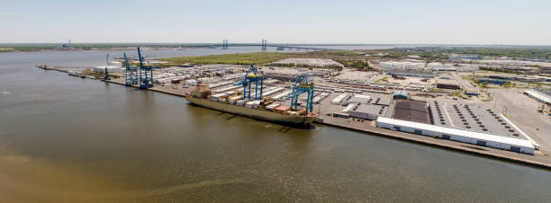 istock A container ship loading in a port. Aerial stitched panorama. 1227445214