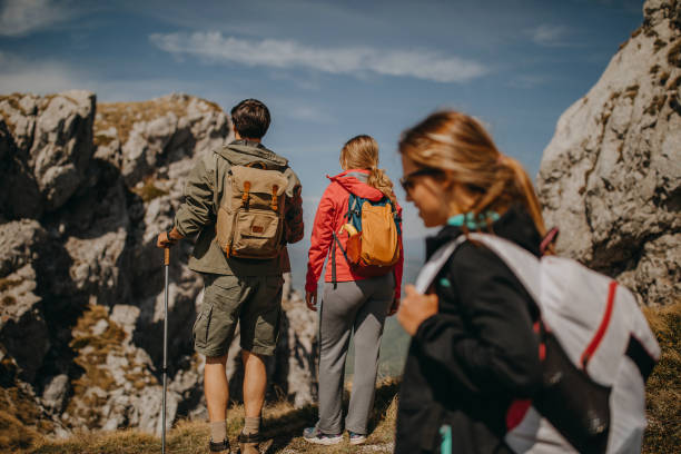 istock Group of hikers, walking over the mauntain 1227448612