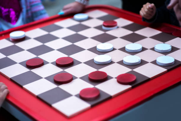 red-white checkers on the board. checkers game