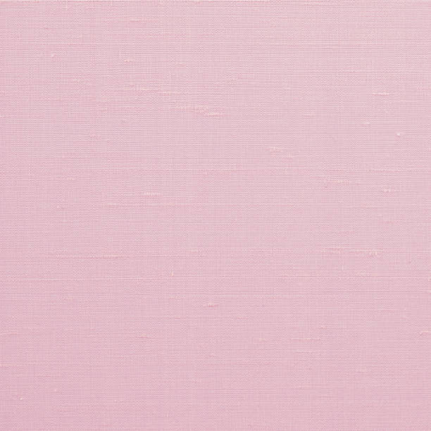 istock Satin cotton silk fabric wallpaper texture pattern background in light pastel old pink rose color tone 1227451721