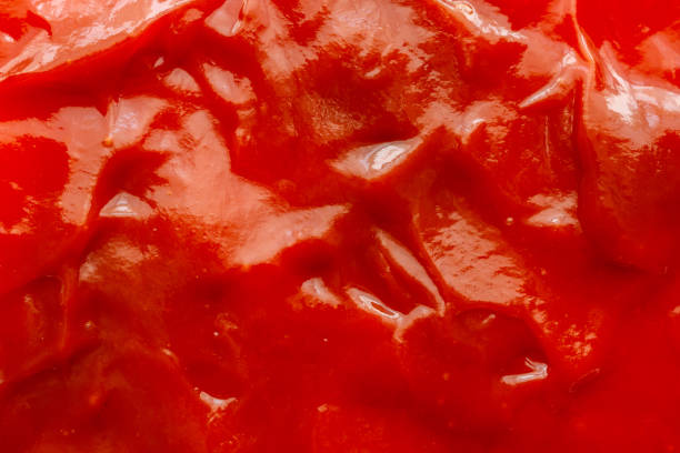 istock Tomato sauce ketchup texture background close up 1227451849