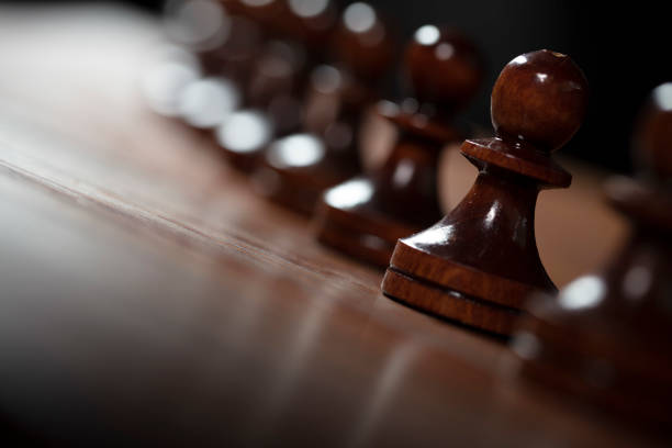 istock Chess pawns standing in a row 1227451885