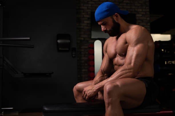 istock Muscular Man After Exercise Resting In Gym 1227452078