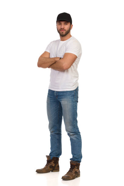 istock Serious Handsome Man In Black Cap Is Standing With Arms Crossed 1227452185