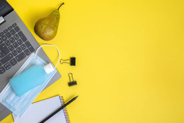 istock protective mask, disinfectant and office supplies 1227452405