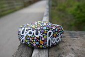 istock Kindness rock with painted you rock message and colorful polka dots 1227454730
