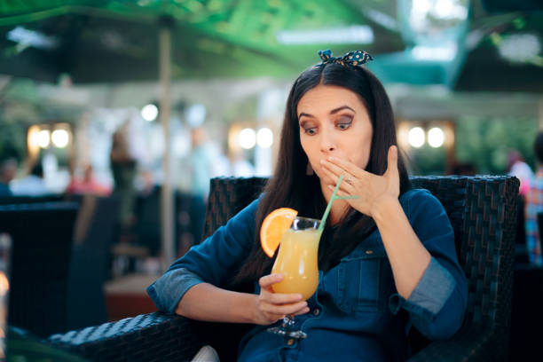 istock Nauseated Woman Drinking Lemonade Feeling Sick 1227456652
