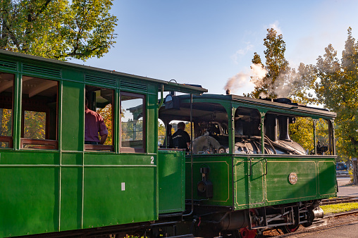 Tourists are waiting to ride the train of Chiemsee railway in Prien am Chiemsee, Germany.