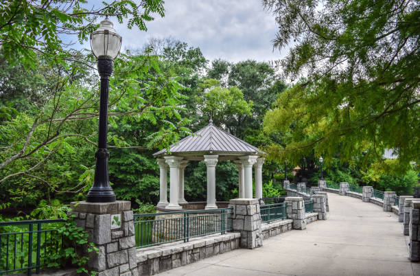 Atlanta's Piedmont Park (Trail and Pavilion by Lake) Wide Pedestrian Walkway (Concrete Bridge) above Pond and Beautiful Gazebo / Pavilion in Piedmont Park - Atlanta, Georgia, USA atlanta georgia stock pictures, royalty-free photos & images