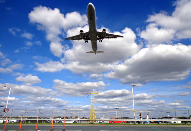 istock Commercial Airliner Flying Above Roadway 1227463705