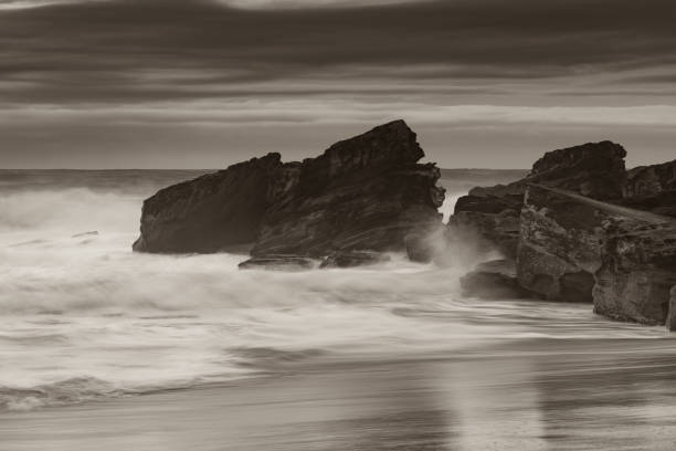 istock Moody Seascape with Large and Powerful Surf in Black and White 1227464459