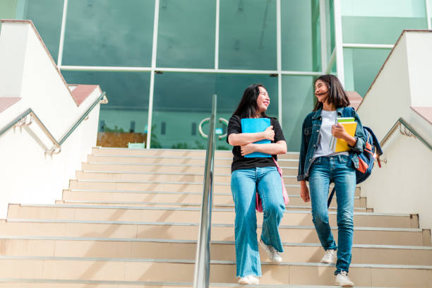istock college student walking up the staircase 1227465474