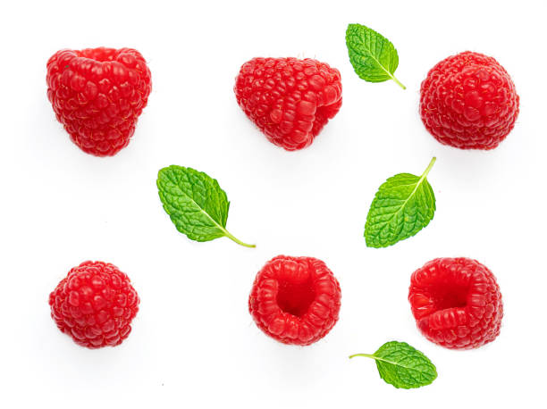 istock Raspberry and mint leves isolated on white background. Fresh Raspberries,  flat lay. Top view 1227469505