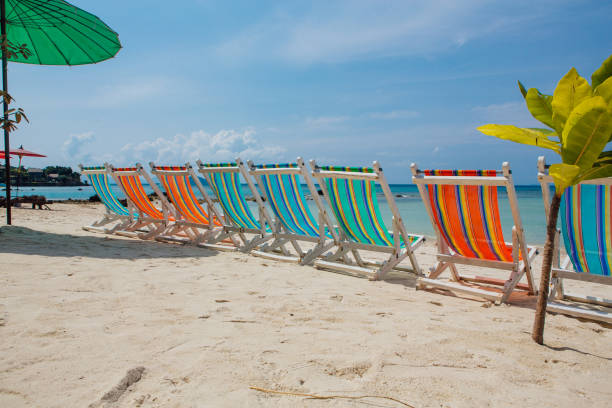 istock Beautiful colorful chairs on the beach 1227470476