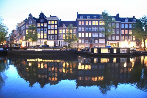 The beautiful house along the canal in Amsterdam stock photo