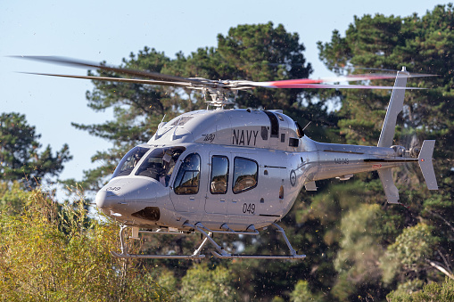 Tyabb, Australia - March 9, 2014: Royal Australian Navy Bell 429 Helicopter N49-049 operated by 723 Squadron based at HMAS Albatross in Nowra, NSW on approach to land at Tyabb airport.