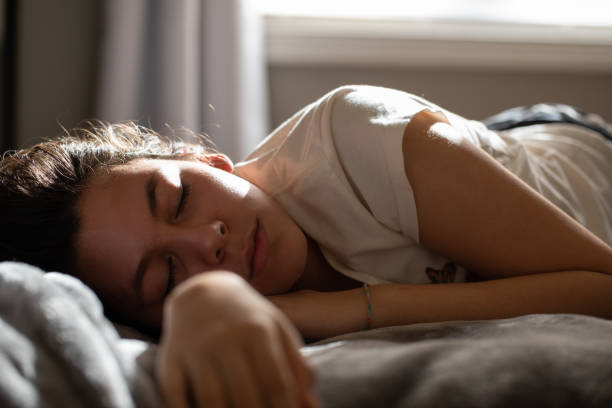 istock teenager falls asleep while studying in bed 1227475577
