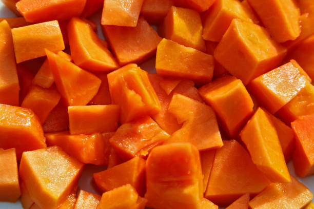 istock Chopped papaya cut into small pieces close-up shot 1227476415