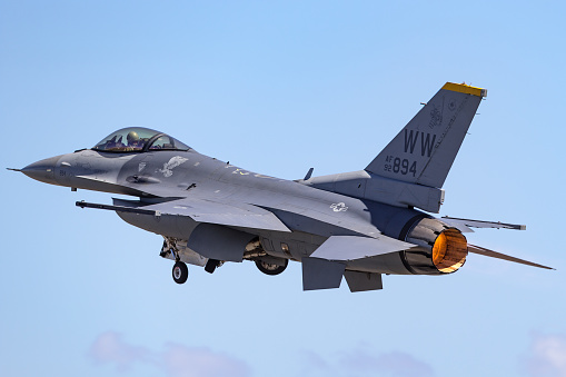 Beja, Portugal: parked General Dynamics F-16 Fighting Falcon of the Portuguese Air Force - Jaguars Squadron, with NATO logo on vertical stabilizer - equipped with external fuel tanks - Beja Airport serves both civil and military aviation.