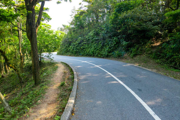 istock Empty asphalt road through a mountain, Hong Kong 1227476650