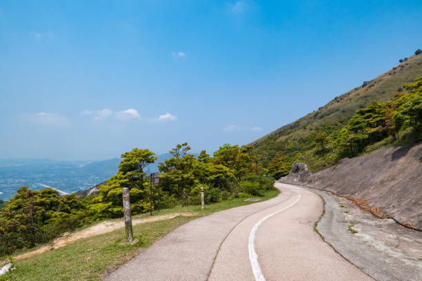 istock Empty asphalt road through a mountain, Hong Kong 1227477338