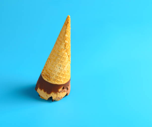 istock side view chocolate and coffee flavor ice cream cone on blue background 1227479963
