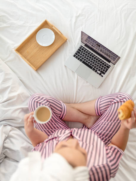 istock womana look at the screen of the computer while having breakfast 1227480741