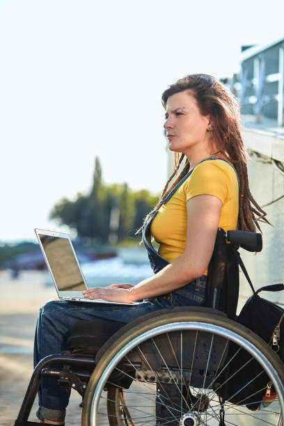 istock serious girl making up a story, writing a book 1227481844