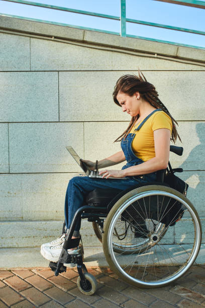 istock cute girl fixing her computer, dowload music, files, documents, video, photos 1227481865