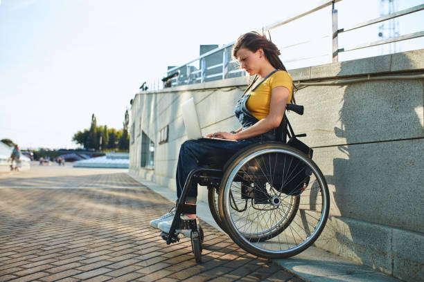 istock beautiful woman with physical challenges working from home 1227482050