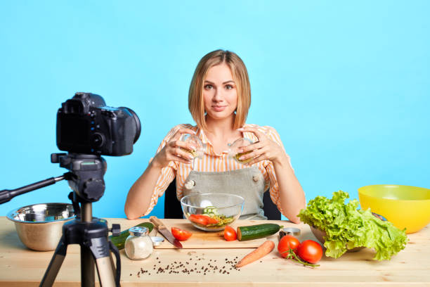 istock Talented female chef created new recipe, making dish in front of camera 1227483253