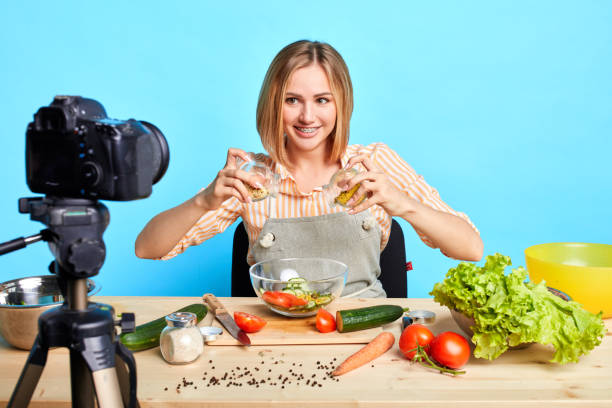 istock Dietitian shooting cooking master class for food blog, making salad with pasta 1227483893