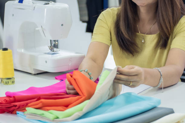 istock Close up on hand selecting textile for making dress 1227484089