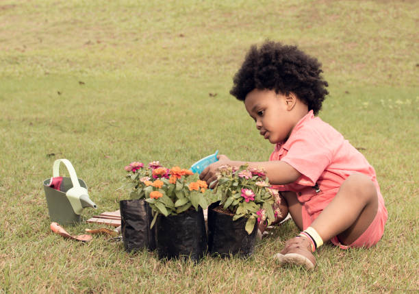 istock African boy is playing in the garden 1227486226