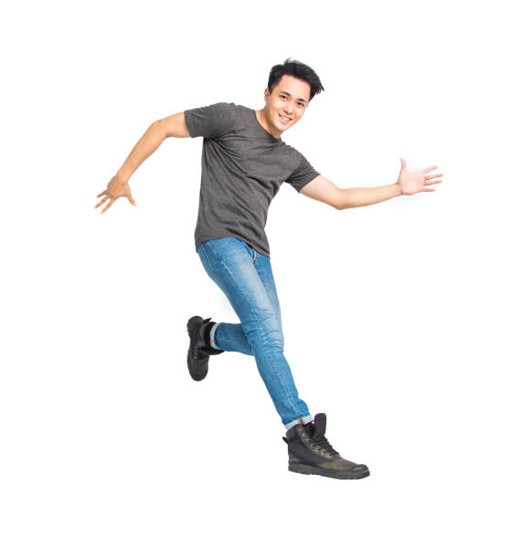 istock happy young asian man dancing and jumping isolated on white 1227486282