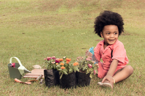 istock African boy is playing in the garden 1227486292