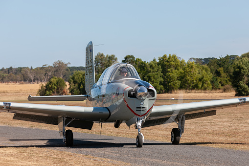 Tyabb, Australia - March 9, 2014: Former United States Air Force (USAF) Beechcraft T-34 Mentor single engined military trainer aircraft VH-XUS taxiing at Tyabb Airport.