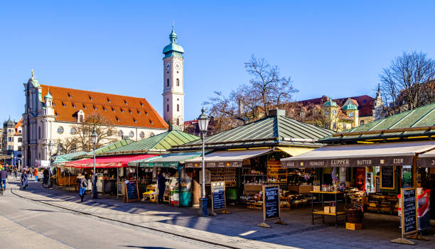 Munich, Germany - February 6: sales stands with fruits and vegetables of the famous Viktualienmarkt in munich on February 6, 2020